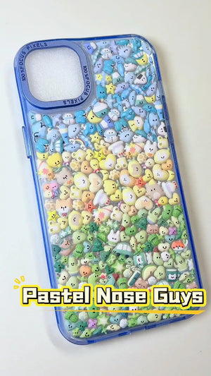 Handcrafted phone case with a pastel ice blue border filled with a dense 3D collage of glossy, transparent Mt. Fuji, travel buses, sundaes, and cute rice ball charms.