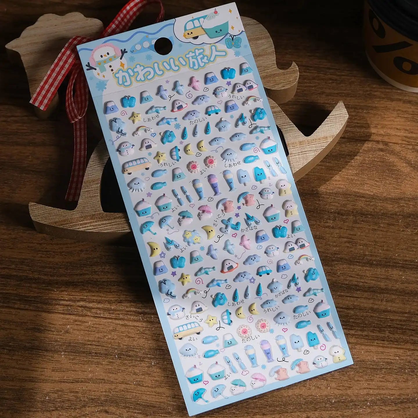 Full sheet display of 3D puffy "Cute Traveler" stickers with blue-themed travel and weather elements, self-adhesive PVC epoxy resin stickers for DIY crafts