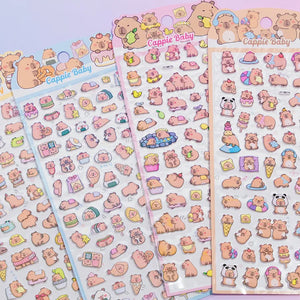 Multi-pack display of 3D puffy Capybara (Cappie Baby) sticker sheets, featuring cute capybara designs with food, relaxing, and playful scenes, self-adhesive epoxy PVC stickers