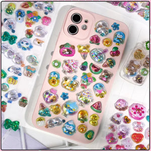 Decorative display of 3D crystal stickers used for phone case DIY, featuring adorable animal and dessert designs, ideal for customizing electronic devices