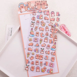 Single sheet of 3D puffy stickers featuring cute Capybara (Cappie Baby) characters with headphone, panda, and dessert designs, self-adhesive PVC epoxy resin stickers for DIY crafts