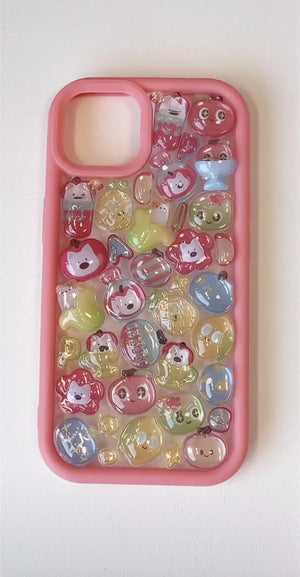 Finished DIY iPhone case with pink frame, decorated with glossy 3D Fruity Diary kawaii stickers, including cute fruit and character designs in pastel colors.