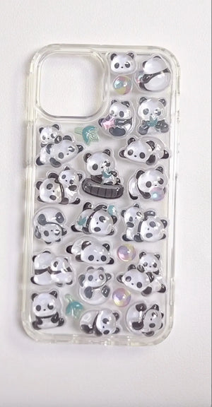 Finished DIY clear iPhone case decorated with glossy Bonbon Drop jelly panda stickers, featuring cute panda and bamboo designs with iridescent details.