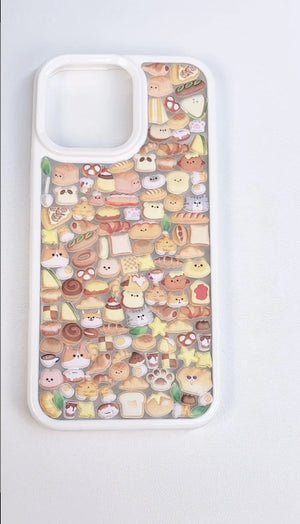 Finished DIY iPhone case with cream frame, decorated with dense mini bread, pastry, and cute animal stickers, creating a warm cozy bakery aesthetic.