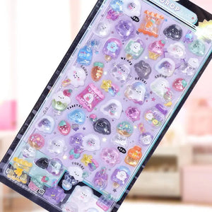 Handheld display of "BONBON DROP" 3D crystal puffy sticker sheet with ghost and pet designs, showcasing cute characters and iridescent effects