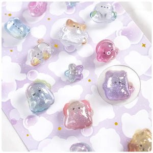 Close-up of 3D crystal clear pet stickers with adorable ghost and cat designs, featuring iridescent and glitter effects, self-adhesive PVC epoxy stickers