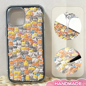 Finished display of handmade DIY phone case with full cat print, clear frame, and cute mini cat patterns