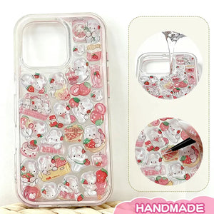Finished display of handmade DIY phone case with full strawberry rabbit print, clear frame, and cute pink rabbit & strawberry patterns