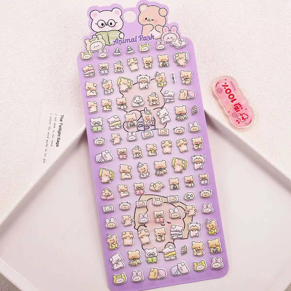 A purple retail sheet of Animal Park 3D glossy drop-seal stickers featuring cute cartoon teddy bears wearing glasses, sleeping in bed, and reading books for DIY crafting.
