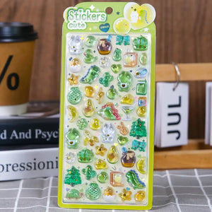 A retail sheet of premium Bonbon Drop Seal 3D glossy stickers with a cute forest theme, featuring cartoon frogs, green dinosaurs, avocados, and turtles.