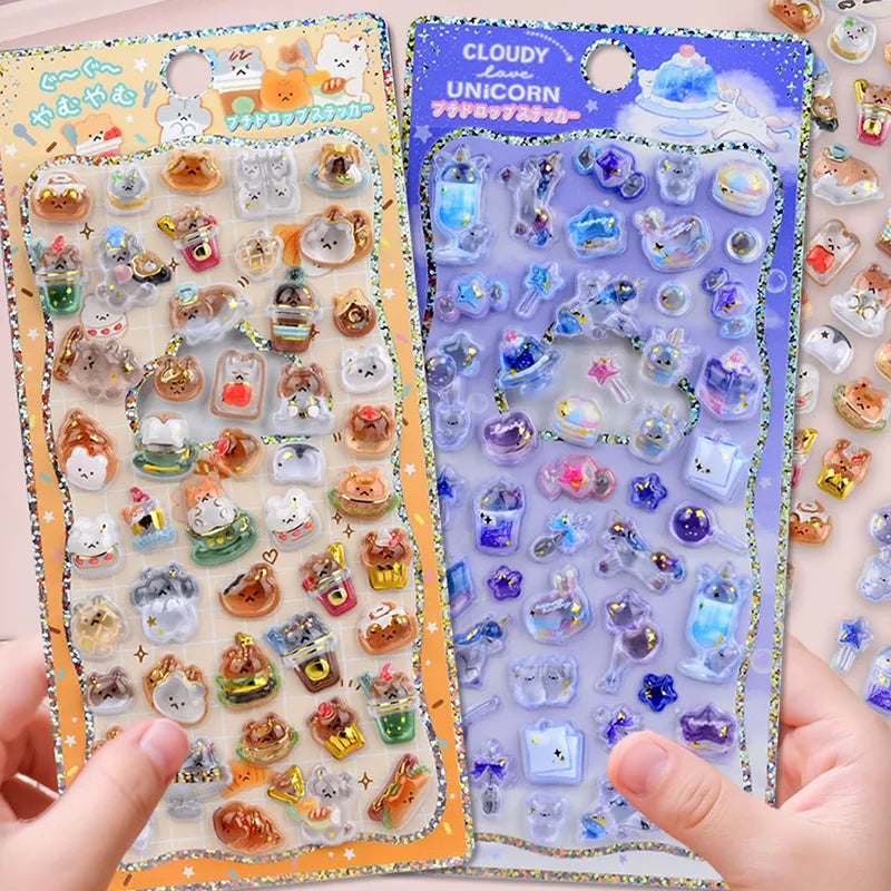 Handheld display of 3D crystal puffy sticker sheets with cute animal and unicorn designs, in orange and purple color schemes