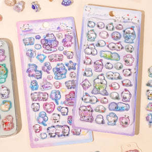 Collection of 3D crystal puffy sticker sheets with adorable dreamy pet designs (long-tailed tit, panda), in pastel purple and blue color schemes