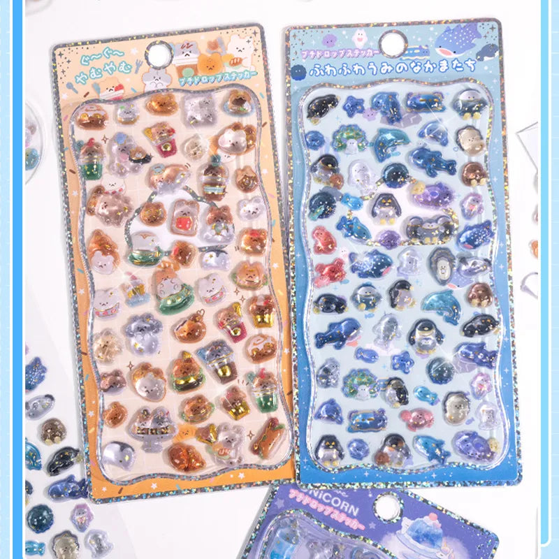 Collection of 3D crystal puffy sticker sheets with cute ocean animal and small animal designs, in orange and blue color schemes