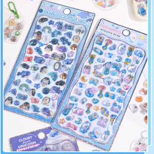 Handheld display of 3D crystal puffy sticker sheets with adorable ocean creature designs (whale, seal, penguin, etc.)