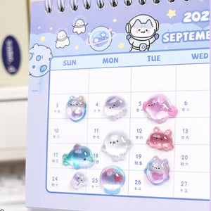 Decorative display of 3D ocean pet crystal stickers used for calendar DIY, featuring cute dolphin, seal, and fish designs with iridescent effects