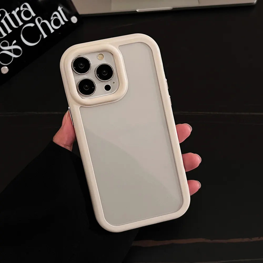 A minimalist off-white contrast hybrid phone case with a transparent clear back and enhanced camera lens protective frame, held in hand.