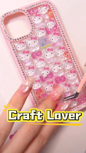 Handcrafted pastel pink phone case fully lined with sparkling diamond rhinestones, filled with a dense 3D collage of clear, glossy Hello Kitty charms.