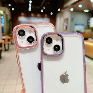 Clear DIY phone case for iPhone with pink/purple gradient protective frame and transparent back panel, featuring raised camera protection, ready for sticker decoration.