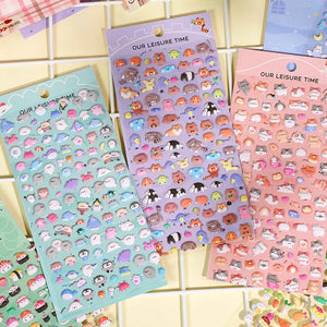 Handheld display of 3 styles of plush bubble stickers (light blue/purple/pink) with cute forest animals, PVC self-adhesive