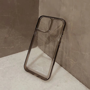 Clear DIY phone case for iPhone with smoky black protective frame and transparent back panel, featuring raised camera protection, ready for sticker decoration.