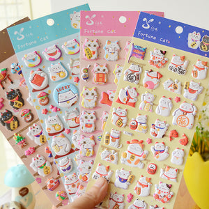 Adorable fortune cat cute paradise-themed 3D bubble gum stickers with lucky cat designs. Perfect for decorating phone cases, laptops & journals. Soft rubber kawaii stickers.