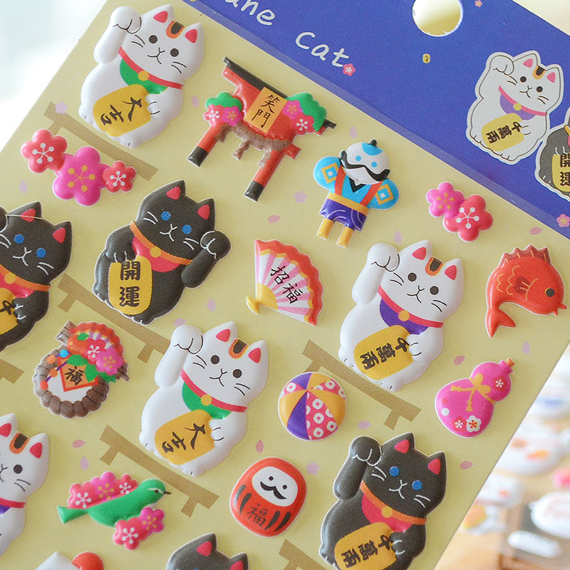 Adorable Japanese fortune cat-themed 3D bubble gum stickers with lucky cat designs. Perfect for decorating phone cases, laptops & journals. Soft rubber kawaii stickers.