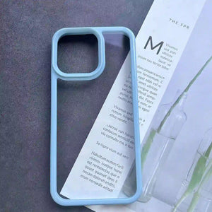 Clear DIY phone case for iPhone with light blue protective frame and transparent back panel, featuring raised camera protection, ready for sticker decoration.