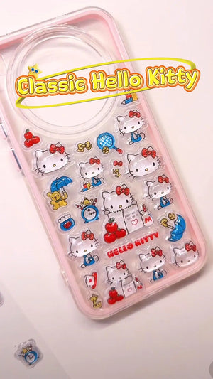 Handcrafted clear pastel pink phone case featuring a dense 3D collage of classic Hello Kitty cartoon charms, red apples, and blue umbrellas.
