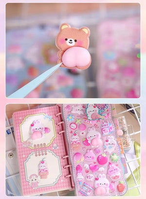 Close-up of 3D peach butt sticker detail (bear) and journal decoration effect, showing soft embossed texture