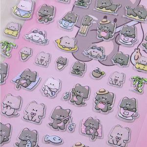 Close-up of 3D puffy "Animal Park" cat stickers, highlighting cute gray and white cats in beach, fishing, and relaxing scenes, self-adhesive PVC stickers
