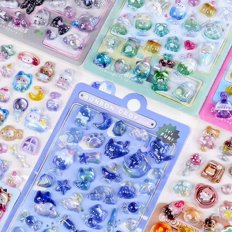 Close-up of BONBON DROP stickers with cute rabbit, bear & cat patterns, showing iridescent epoxy texture	