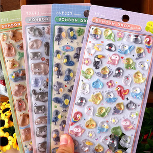 Collection display of 4 BONBON DROP 3D crystal sticker styles (capybara, cat, shoebill, bird), cute animal designs	