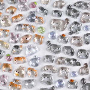 Close-up of BONBON DROP 3D crystal cat & rabbit stickers, showing transparent embossed texture