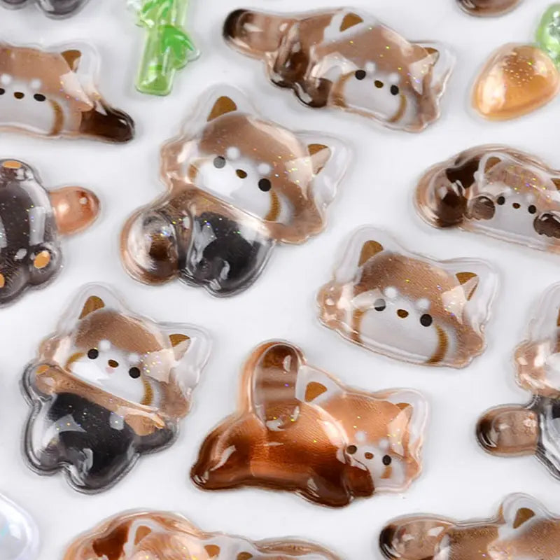 Close-up of BONBON DROP 3D crystal red panda stickers, showing transparent embossed texture with glitter