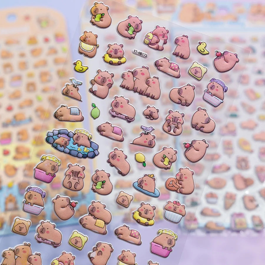 Close-up of 3D puffy Capybara stickers, highlighting cute capybara motifs with hot spring, fruit, and daily life elements, self-adhesive PVC stickers
