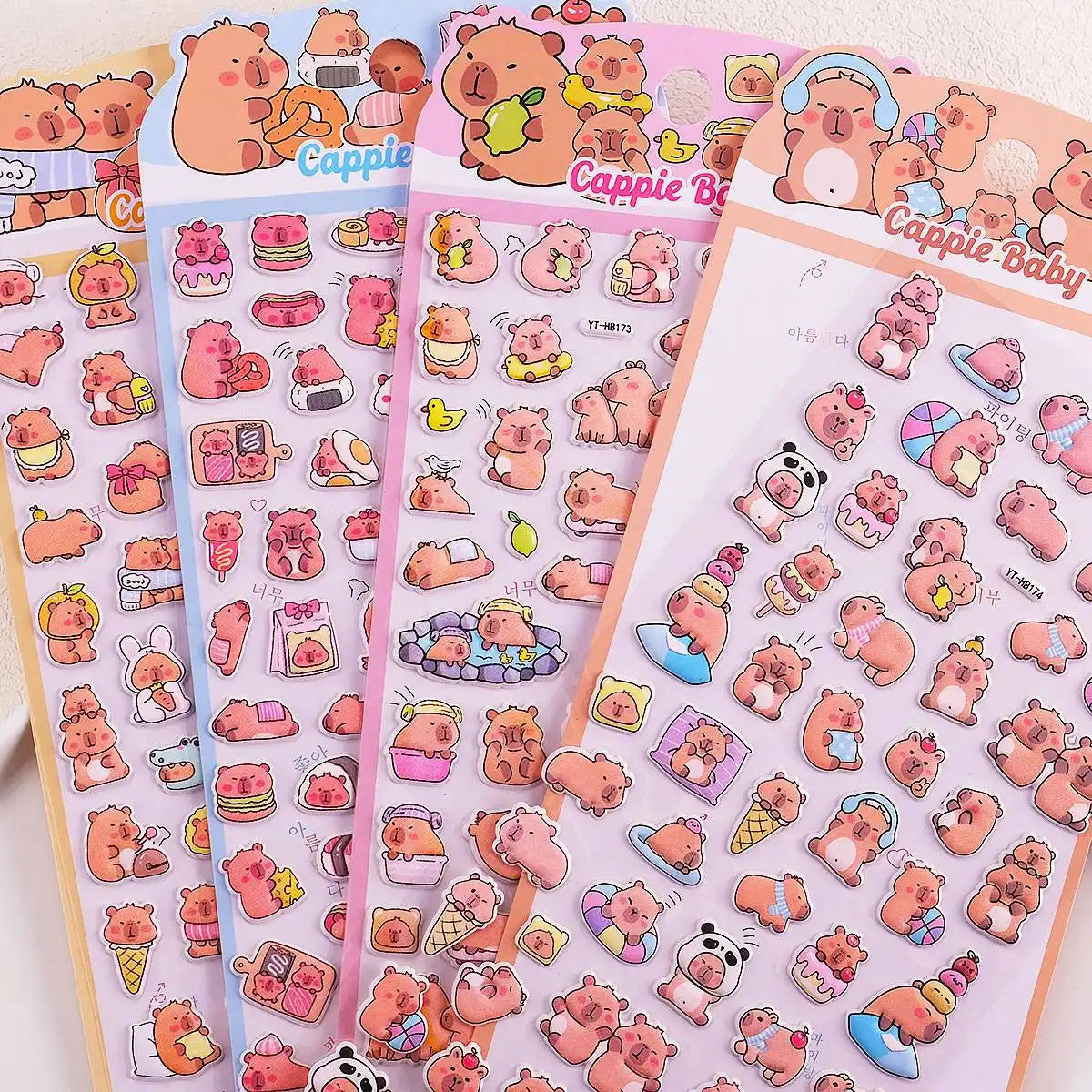 Multi-pack display of 3D puffy Capybara sticker sheets, showcasing cute cartoon capybara designs with food, relaxing, and playful scenes, self-adhesive epoxy PVC stickers
