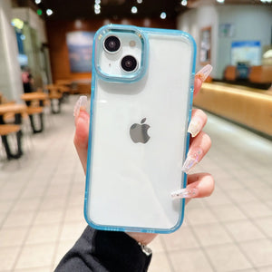 Minimalist clear transparent blue acrylic phone case with a metallic lens protection bumper, held in hand.