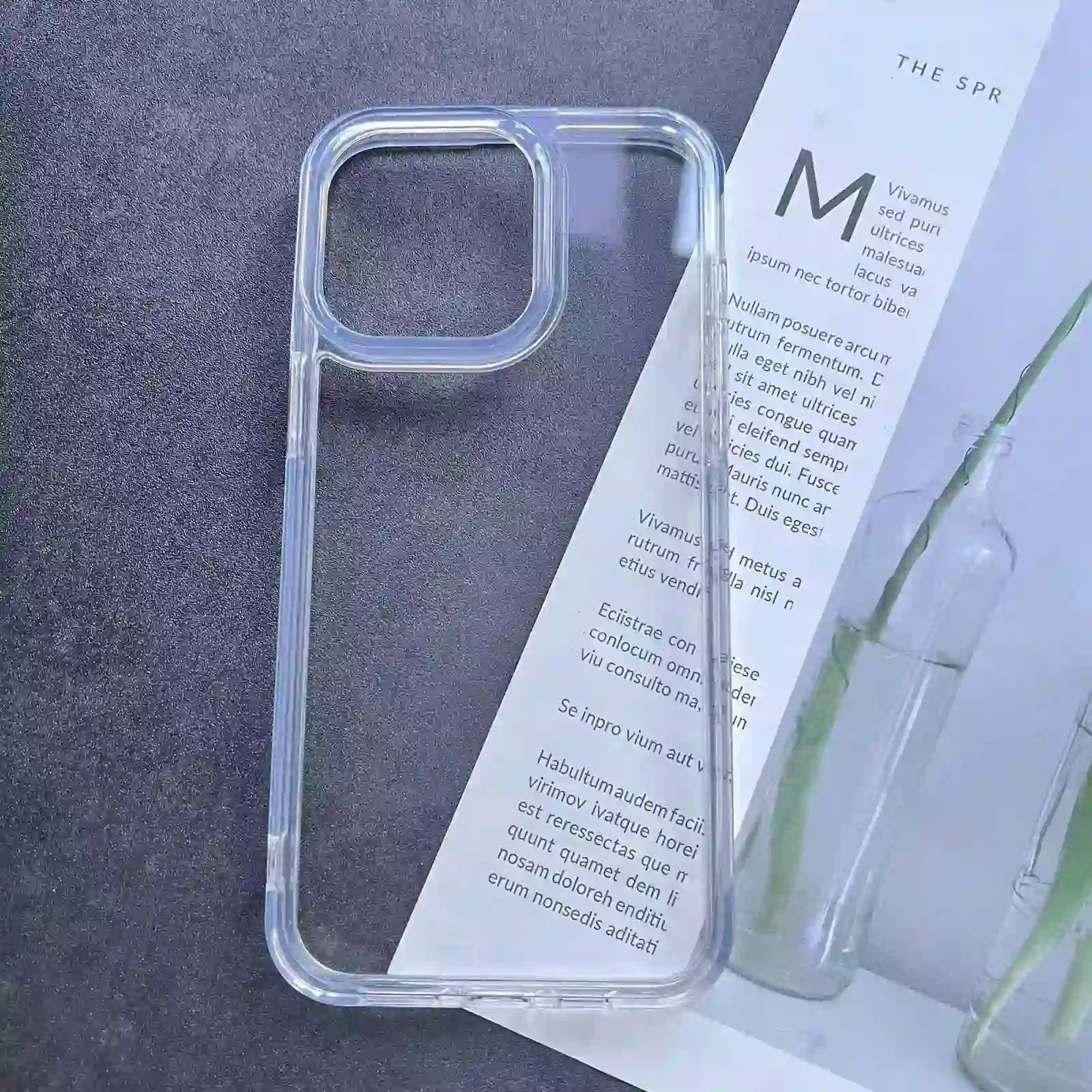 Clear transparent shockproof DIY phone case for iPhone, with reinforced corners and raised camera protection, ready for sticker decoration.