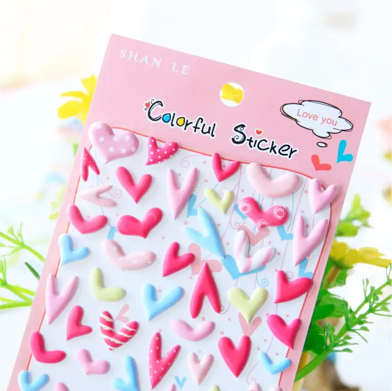 Close-up of "Colorful Sticker" 3D puffy heart stickers with varied shapes and pastel colors (pink, red, blue, yellow), perfect for romantic DIY decoration.
