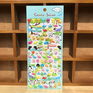 Display of "Colorful Sticker" 3D puffy dinosaur & animal stickers, featuring colorful designs of dinosaurs, zebras, penguins, and other jungle creatures.