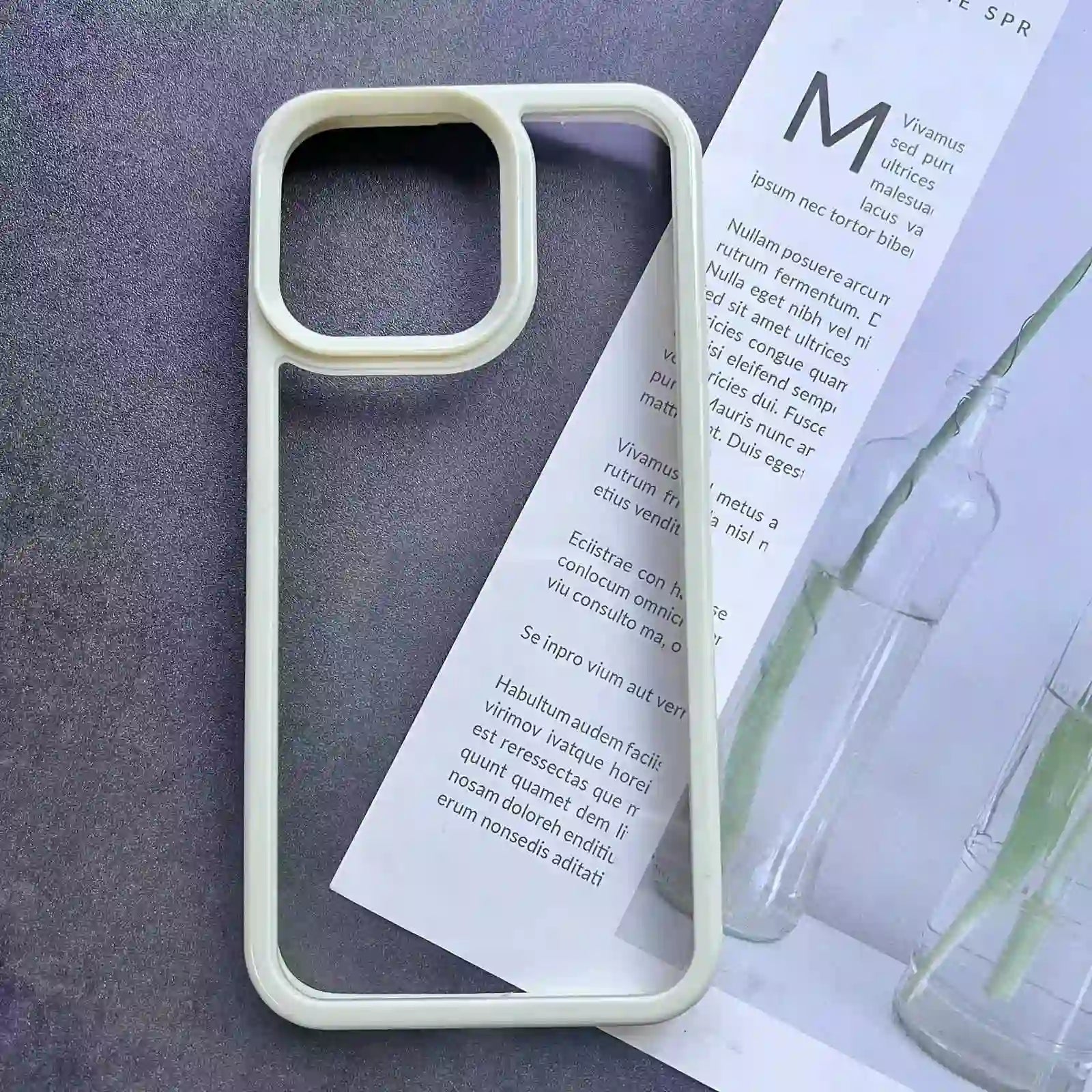 Clear DIY phone case for iPhone with cream-colored protective frame and transparent back panel, featuring raised camera protection, ready for sticker decoration.