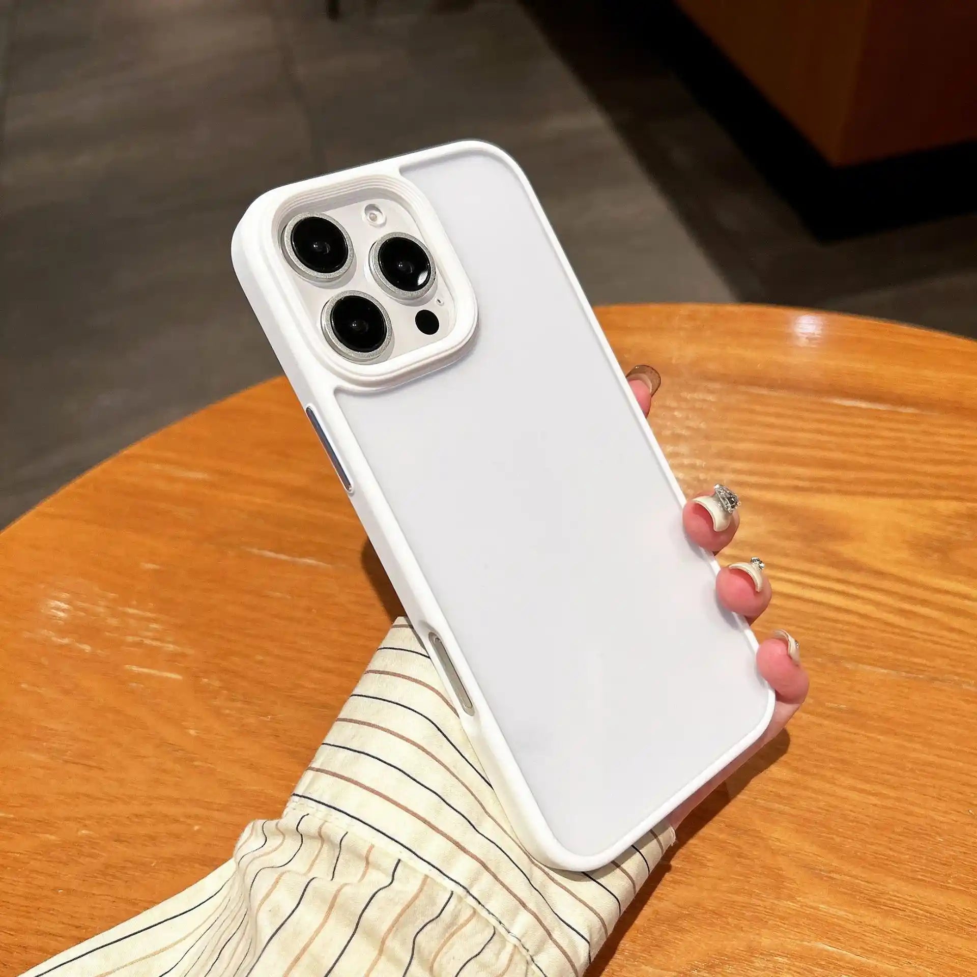 Clear DIY phone case for iPhone with cream-colored protective frame and transparent back panel, featuring raised camera protection, ready for sticker decoration.