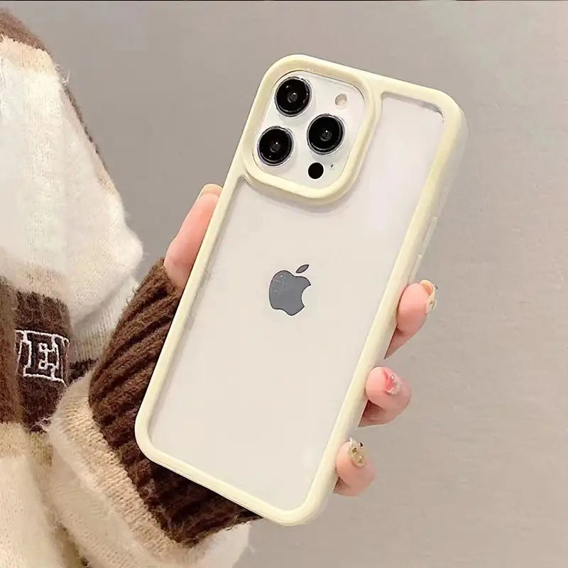 Clear DIY phone case for iPhone with cream-colored protective frame and transparent back panel, featuring raised camera protection, ready for sticker decoration.