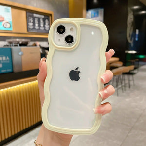 Clear DIY phone case for iPhone with cream-colored wavy protective frame and transparent back panel, featuring raised camera protection, ready for sticker decoration.