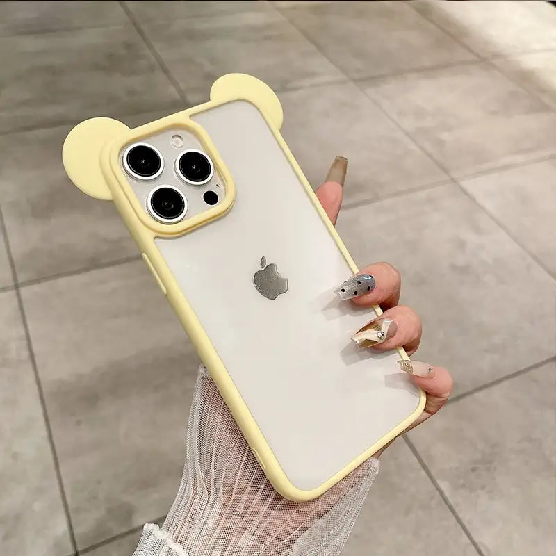 Clear DIY phone case for iPhone with cream yellow bear ear frame and frosted back panel, featuring raised camera protection, ideal for sticker decoration.