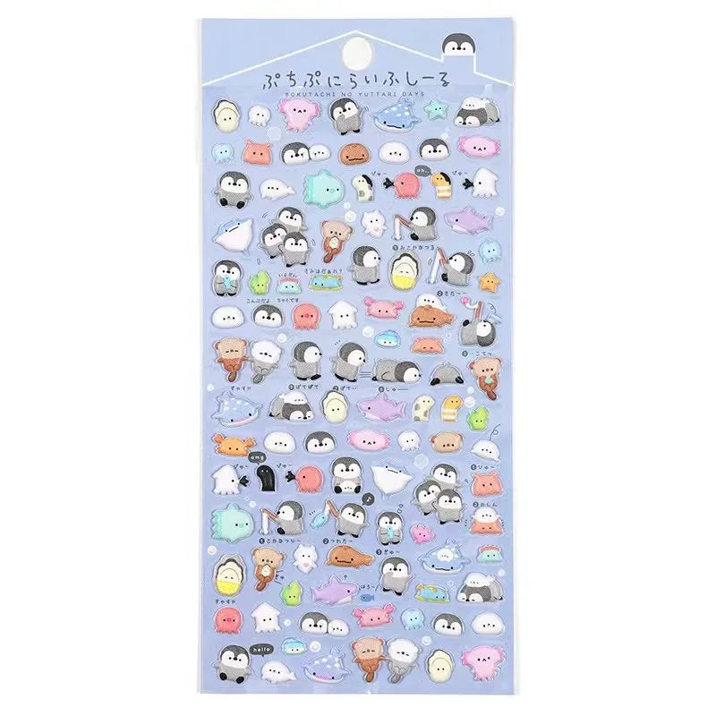 A sheet of 3D resin stickers featuring cute penguins, ice cream cones, and summer sodas in a refreshing blue and pastel theme.