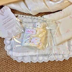 Small pastel cat and dessert shapes arranged together in clear packaging.