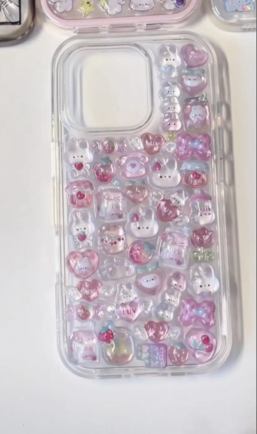 Finished DIY clear transparent iPhone case decorated with pink Bonbon Drop kawaii stickers, featuring cute rabbits, hearts, and sweet designs.

