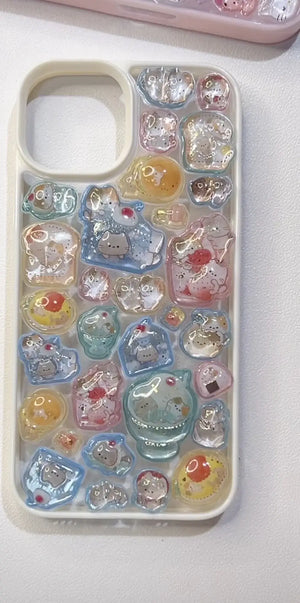 Handmade DIY phone case featuring 3D resin cat stickers and cute dessert charms like ice cream, toast, and pancakes on a cream-white frame.