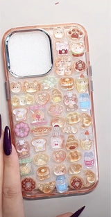 Finished DIY iPhone case with rose gold frame, decorated with glossy Bonbon Drop bread and dessert stickers, including cute bears, donuts, and milk bottle designs.